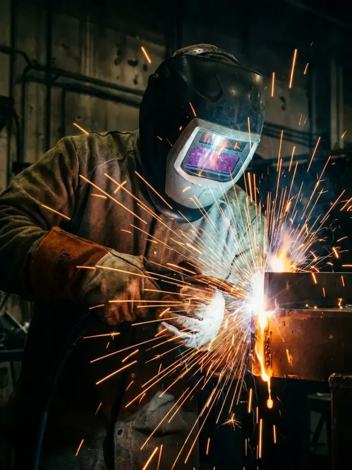 welder in action with sparks flying